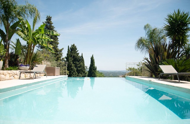 luxury villa with pool and panoramic sea and village