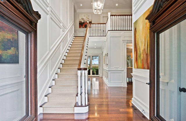 Majestic Dutch Colonial retreat sited on two acres of lush acreage,.
