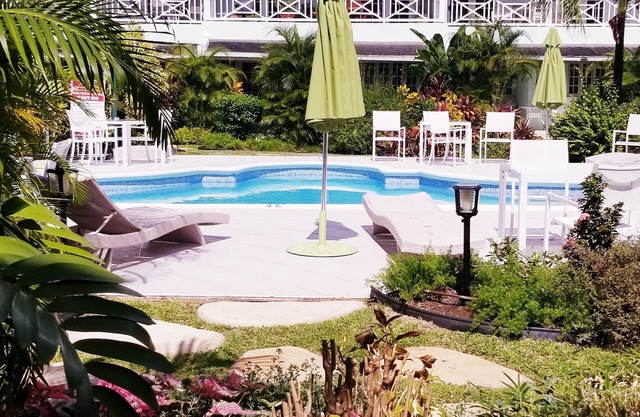 Modern Barbados condo with WIFI, walk out to POOL, steps from BEACH
