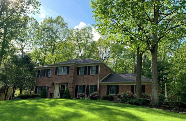 Modern colonial home with hot tub and fire pit close to Penn State