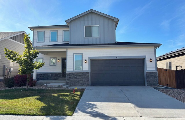Modern home with a large fenced yard, and garage access