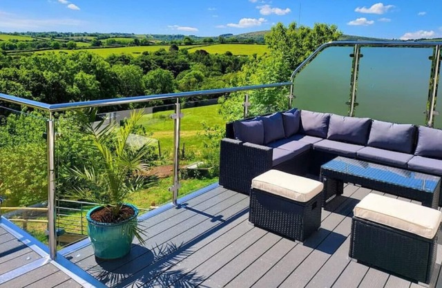 Modern home with stunning views across Rilla Mill!
