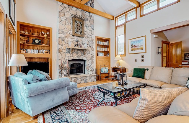Mountain-view townhome with seasonal pool, ski shuttle, & private deck