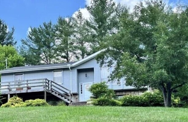 Nestled in the woods above the French Broad River, quite subdivision.