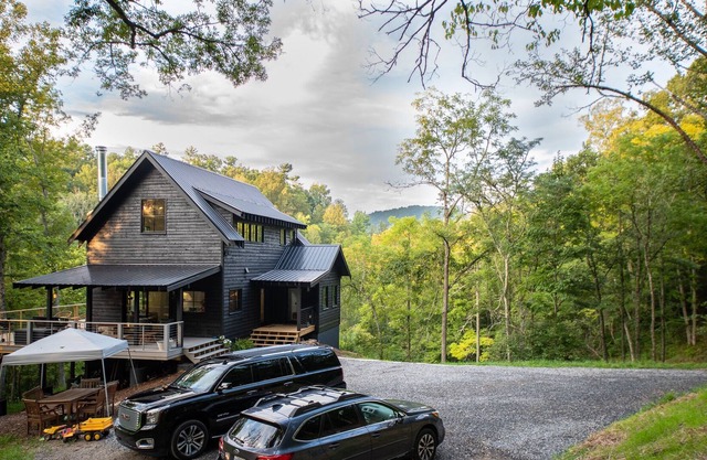New construction located on 15 acres with private frontage on the Big Ivy River