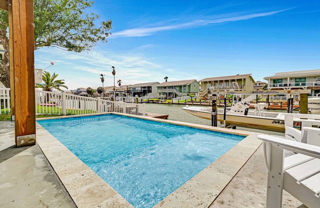 Newly constructed, canal-front home with private dock, covered deck, pool & W/D