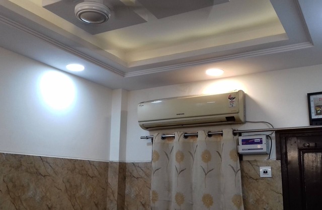 One bedroom apartment with attached kitchen and washroom along with fridge