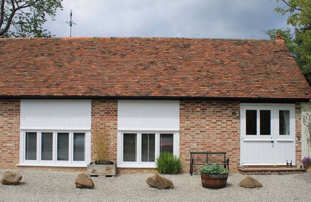 One of a pair of beautifully converted stables set over 2 floors with a wealth of beams, and origina