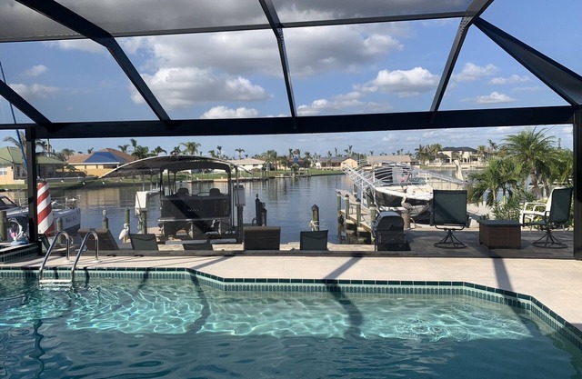 Orchid Lighthouse Canal Pool home with New waterfront Patio!