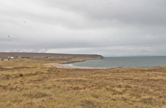 Overlooking the sweeping sandy bay of Opinan on the stunning west Highland coast .