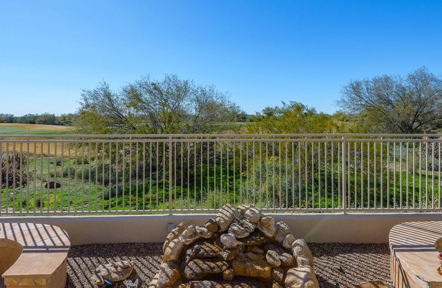 Overlooking the golf course w/ sunset views in a quiet gated neighborhood