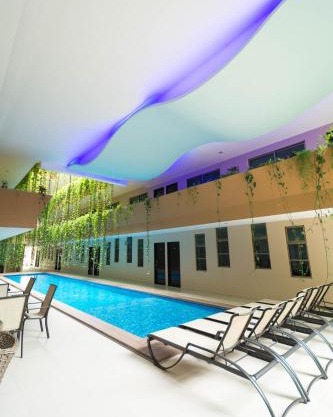 Palmarena Rooms & Residences - Long Stay Comfort with Parking, Sauna, Gym & Pool - Steps from 5th Avenue