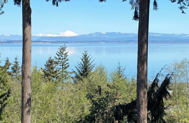 Panoramic View House of Puget Sound with hot tub and walls of windows