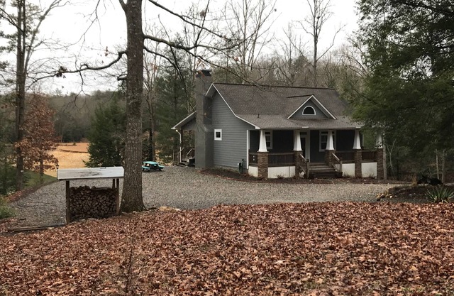Peaceful lakefront house on Lake Nottely. Large secluded cove with boat dock.