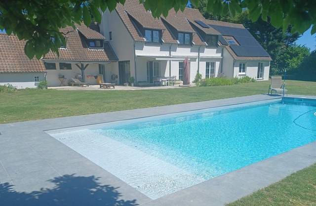 private apartment in a bucolic setting with outdoor heated pool and tennis court