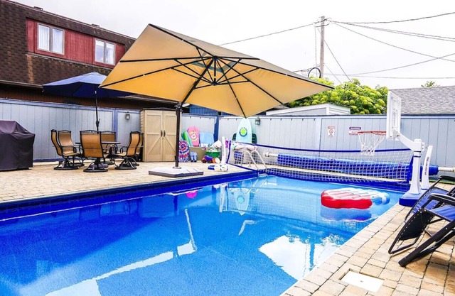 Private heated pool in back & Sandy beach in front