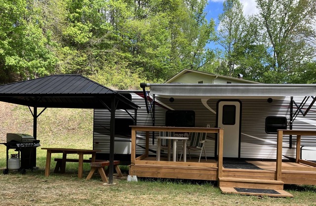 Rader Retreat RV/Camper cozy spot to sit out on the deck after a day of hiking.