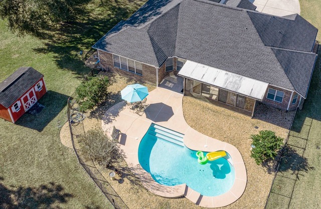 Relax in our cozy 3 BR home with a spacious master suite with soaking tub, large yard, pool, BBQ