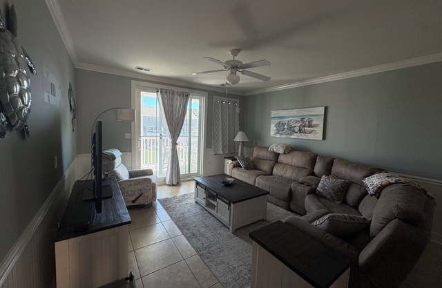 Relax in this 3BR 2BA second floor condo in gated community with pool and beach