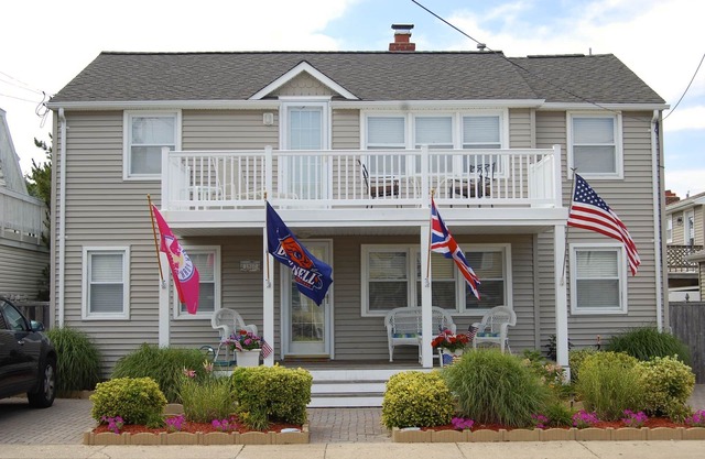 Relax on the deck of this 2nd floor oceanside duplex just steps from the beach.