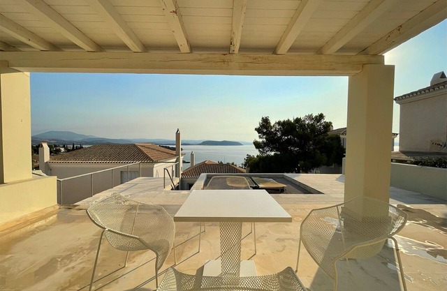 Seafront architectural villa in exclusive Aghios Emilianos. Incredible views!