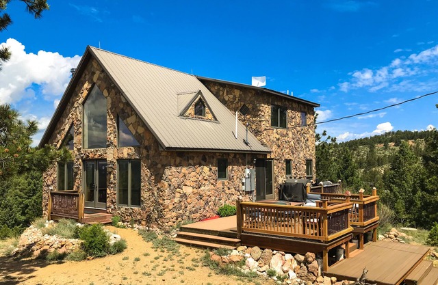 Secluded home on 5 acres with great mountain views, decks, wood stove & W/D