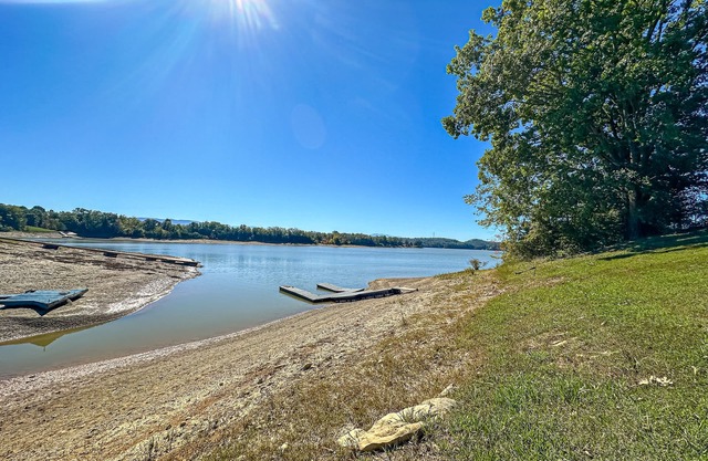Serene lakefront home w/free attraction tickets, dock, game room, & fire pit