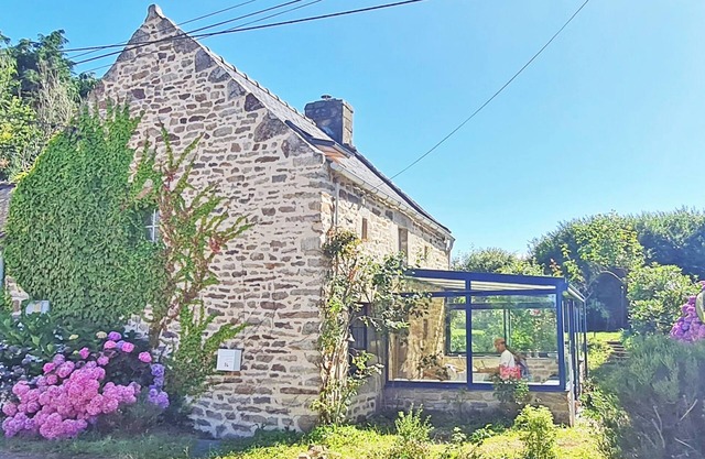Small stone house with authentic garden