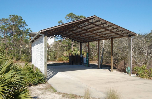 SPACIOUS COVERED RV LOT WITH A LARGE CONCRETE PAD