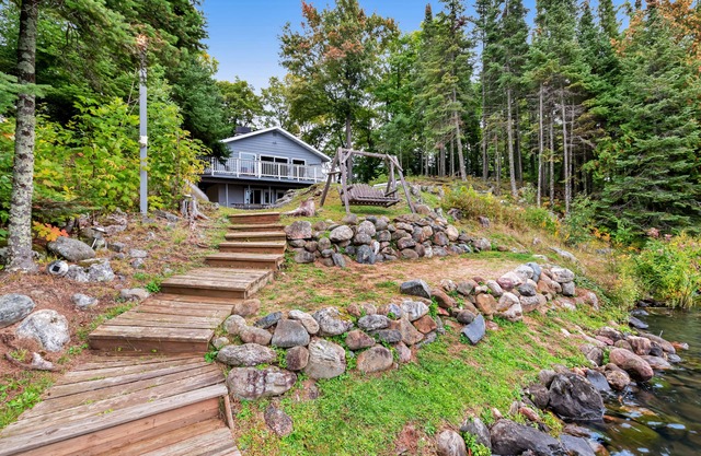 Spacious lakefront home with pier views, canoe, and fire pit - family-friendly