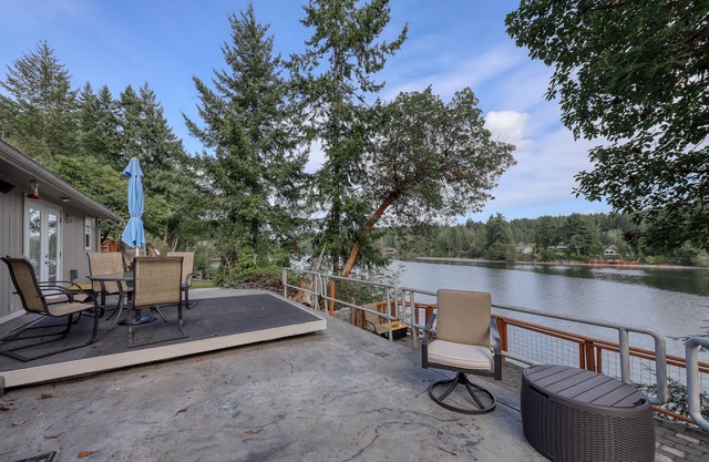 Spacious waterfront home with hot tub, large decks, kayaks, and beach access
