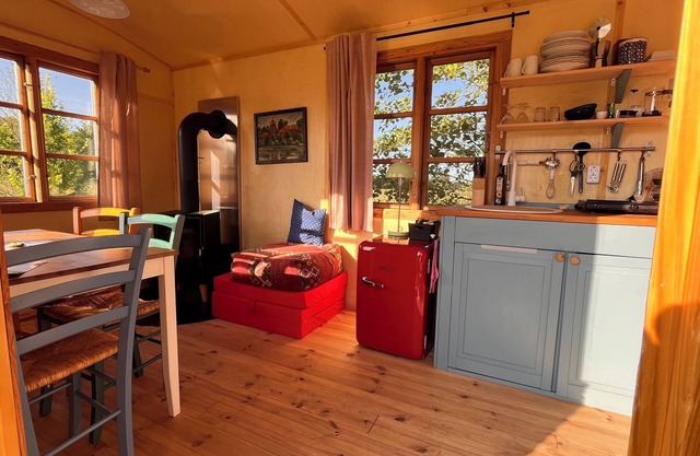Spend the night in a beautiful circus wagon on the sheep pasture