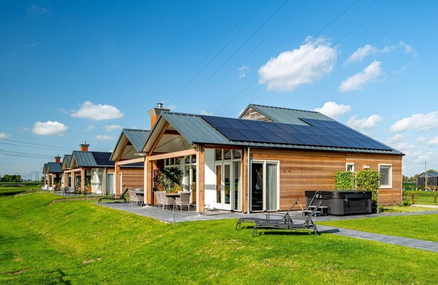 Stay in our semi-detached Anker 8 Wellness bungalow with a sauna, an outdoor spa, and a sunshower.