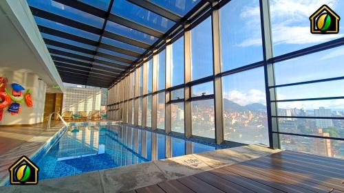 Stylish Loft with Pool, Sauna & Gym 24x7, Near Zona G