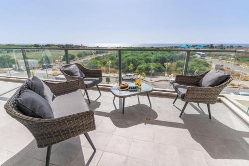 Sunlit Balcony and Coastal Charm by Sea N' Rent