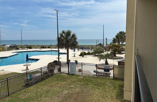 This bright and colorful "beachy" condo is perfect for those seeking the sun!