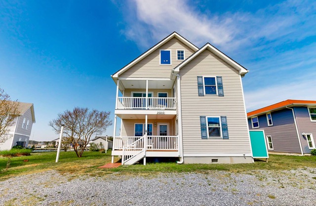 Town of Ocean View canal-front home with dock, kayaks, balconies, grill, & AC