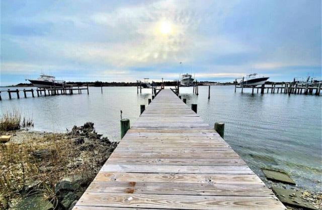 Two Waterfront homes with two private docks, two hot tubs, Seven bedrooms and 4 bathrooms with boat lift.