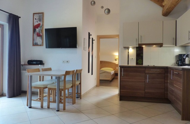 Vacation apartment with large panoramic balcony and organic natural bathing pond