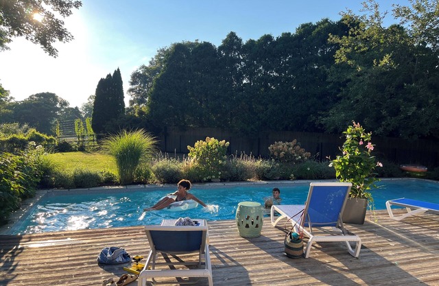 Walk to town, Bike to beach, Private pool oasis !