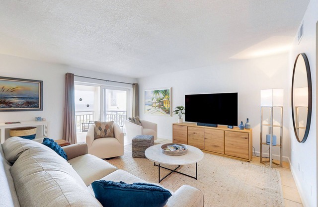Waterfront condo with amazing ocean view, resort pool, beach access, & W/D