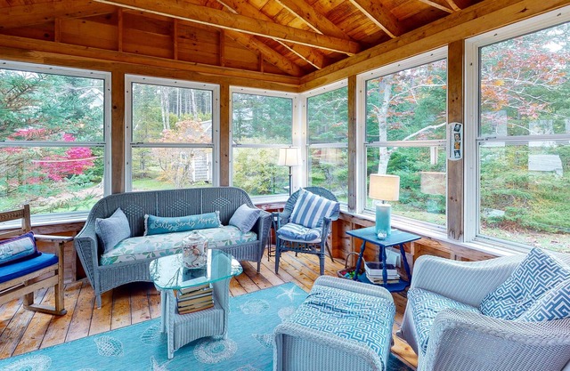 Waterfront cottage on Spruce Head Island with dock, beach access, and large yard