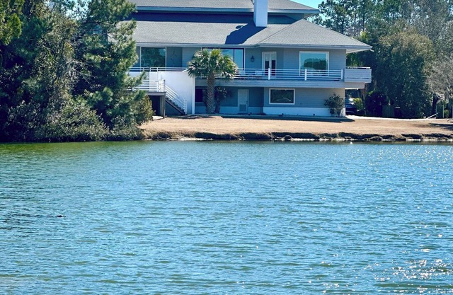 Waterfront Luxury Home w 5 bd-5.5 bath, private pool situated on 1 acre property