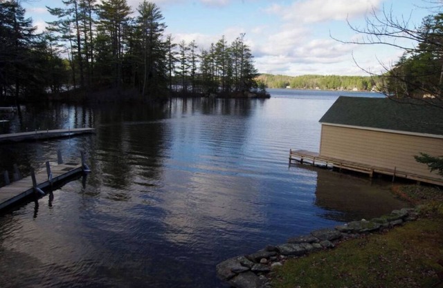 Waterfront property on pond with private dock .