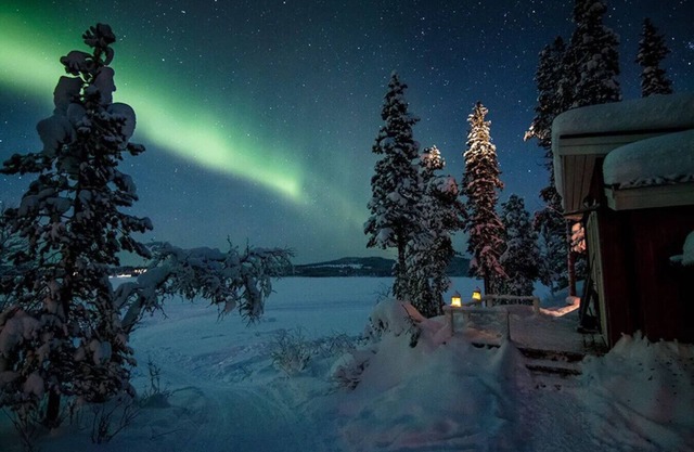 Waterfront with fantastic views and the midnight sun on the horizon