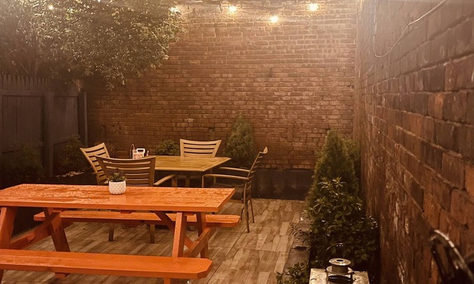Historic Downtown House | 1850s historic Row House 7min train to NYC with private backyard
