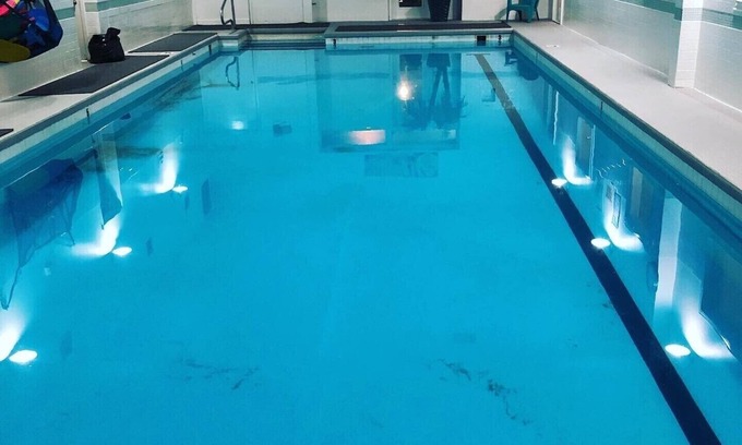 Quincy Condo | 2 Bedroom Downtown Condo above Gym with Pool Hot tubs sauna etc.