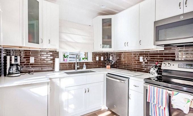 Neptune Beach House | 3/2 Pool Home - 2 blocks from bch - w/ Golf Cart!