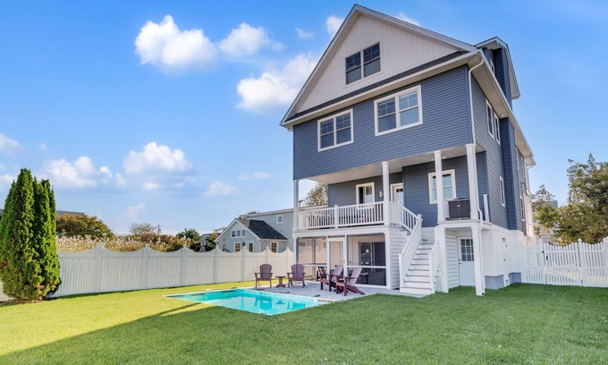 Admiral Estates House | 3 levels with 5 bedrooms, 4.5 baths, elevator, heated pool, and lots of gathering spaces both inside and out!