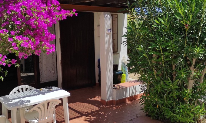 Villaggio Mandorli House | 350 mt from Campus, small bungalow with outdoor space surrounded by greenery.